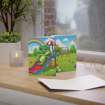 🐊🌈 The Little Crocodile Playground Adventure Greeting Card – Whimsical Animal Adventure