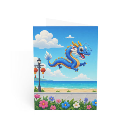 🐉🛴 The Dragon Day At The Seaside Greeting Card – Whimsical Animal Adventure
